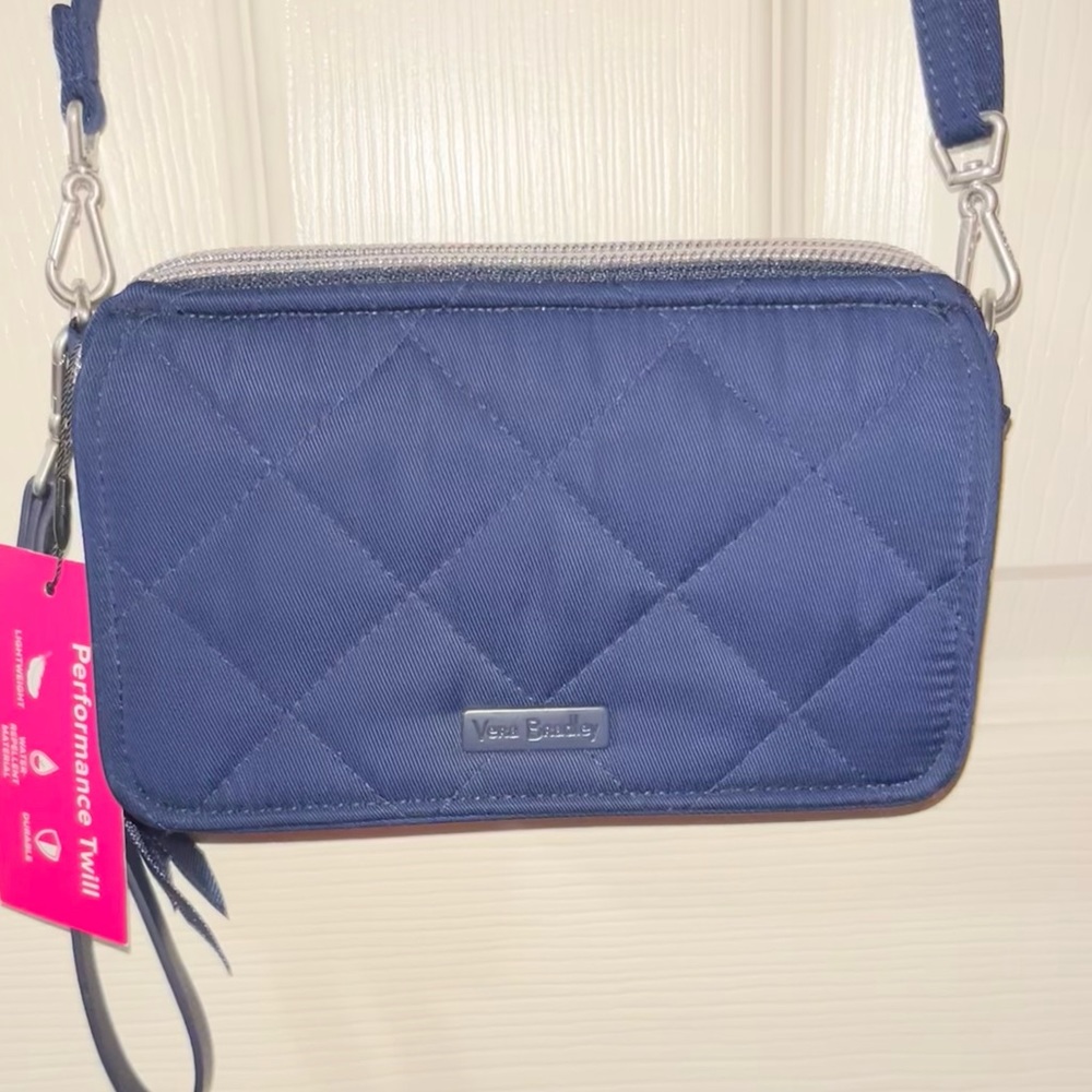 Vera Bradley RFID All in One Crossbody. Exterior features a phone slip pocket.